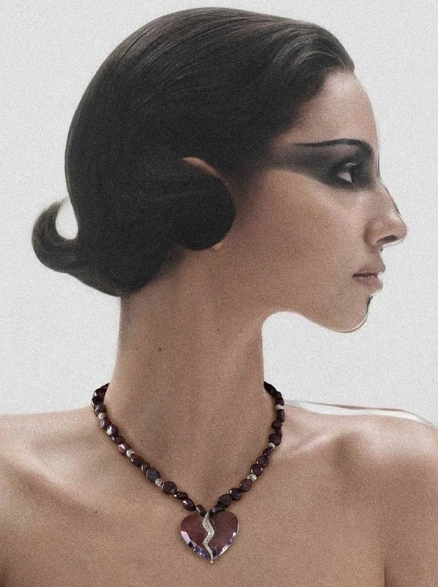 Detail view of Completed Hearts Garnet Necklace showing connected heart design